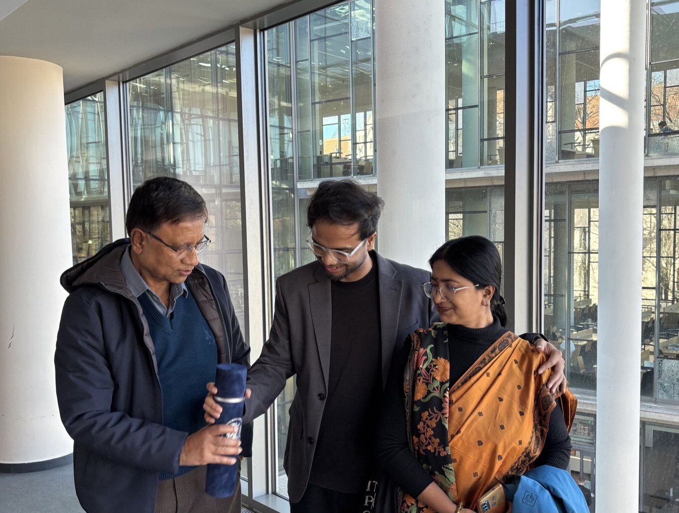 Avratanu Biswas with his parents at the PhD award ceremony in Szeged